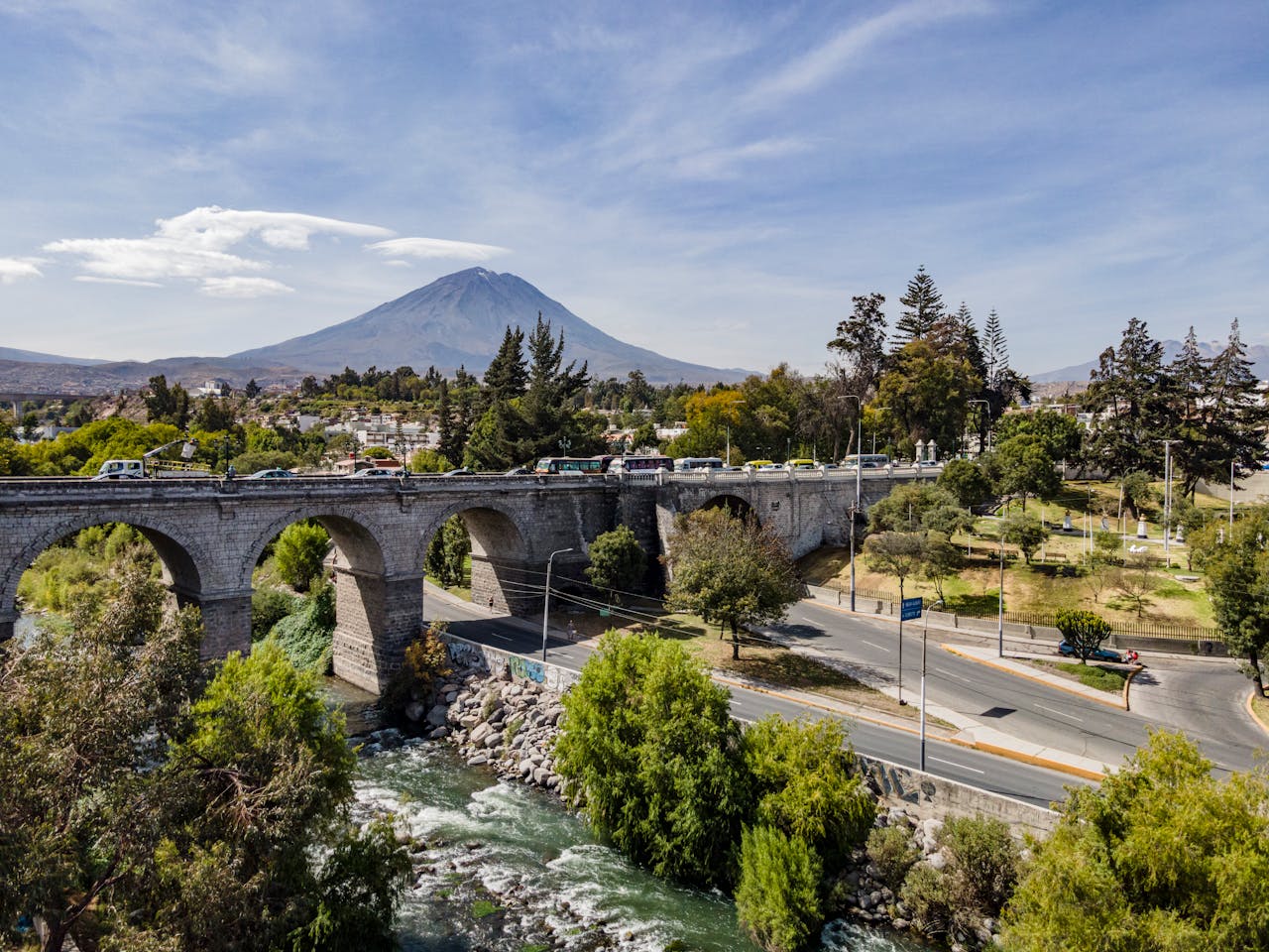 why-choose-us-01 Aerial view of Puente Grau with El Misti in the background, Arequipa, Peru.